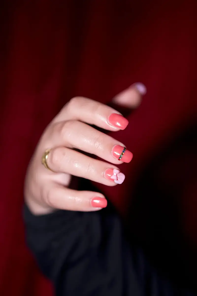 Hand with pink nail art